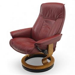 Ekornes - 'Stressless' maroon leather reclining swivel armchair, with high padded back and panel-stitched upholstery, shaped armrests, on a circular laminated wood swivel base