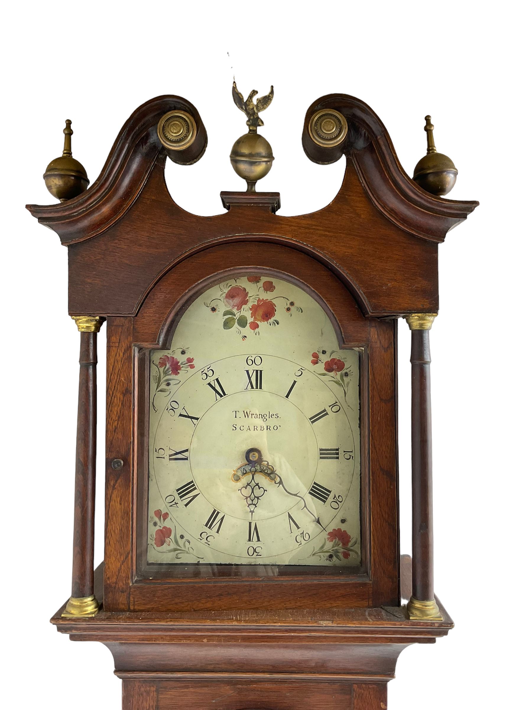 Thomas Wrangles -  early 19th-century oak longcase clock with a swans neck pendulum and three brass finials, glazed hood door flanked by two free standing pilasters, long trunk door with a break-arch top on a square plinth raised on bracket feet, painted dial inscribed T Wrangles Scarboro, dial pinned directly to a 30-hour chain driven count wheel movement striking the hours on a bell.
 With pendulum and weight. 