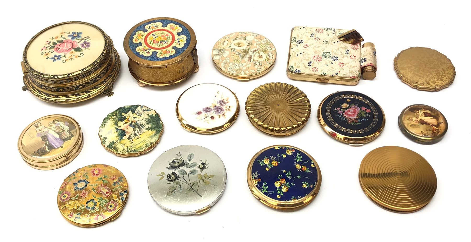 Collection of vintage floral pattern powder compacts and dressing table