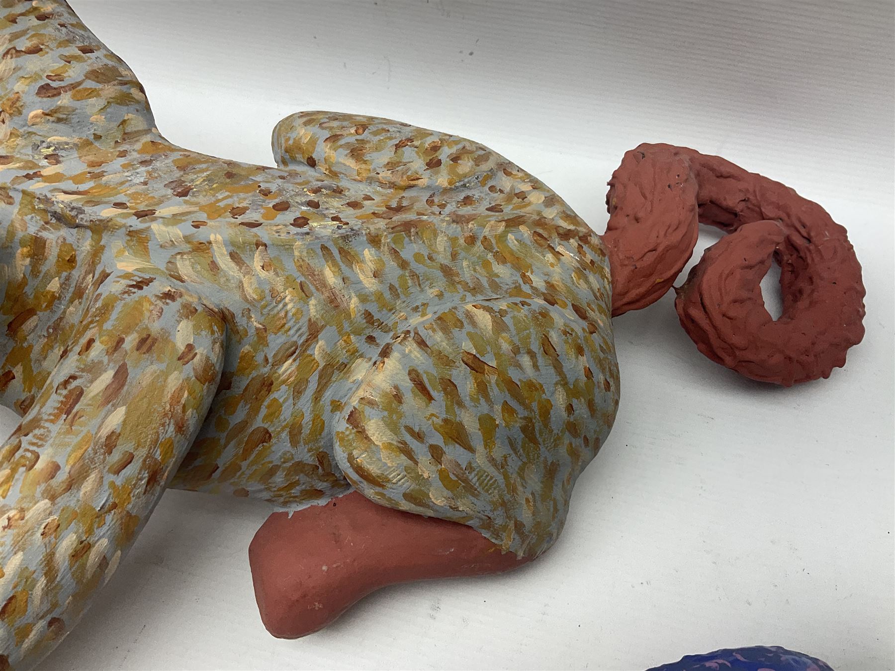 Helen Skelton (British 1933 – 2023): Two carved wooden abstract sculptures, one modelled as a dog, the other modelled as a bear, both with painted stippled decoration, largest H20cm. Born into an RAF family in 1933 in Kent and travelled the world extensively during her childhood. After settling in Bridlington, Helen immersed herself in painting, textiles, and wood sculpture, often inspired by nature's beauty. Her talent was showcased in a one-woman show at Sewerby Hall and recognised with the sculpture prize at Ferens Art Gallery in 2000. Sadly, Helen’s daughter passed away from cancer in 2005. This loss inspired Helen to donate her sculptures to Marie Curie upon her passing in 2023.