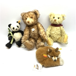Two limited edition Steiff teddy bears, with jointed limbs, glass eyes, and white tag and button to ear, 2740/5000, and 3154/4000, together with a Steiff Panda, and Steiff Fox. (4). 