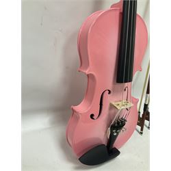 Zest full size pink violin, with a solid wood body and maple head, with matching pink bow and two further bows, in a hard case Length 60cm
