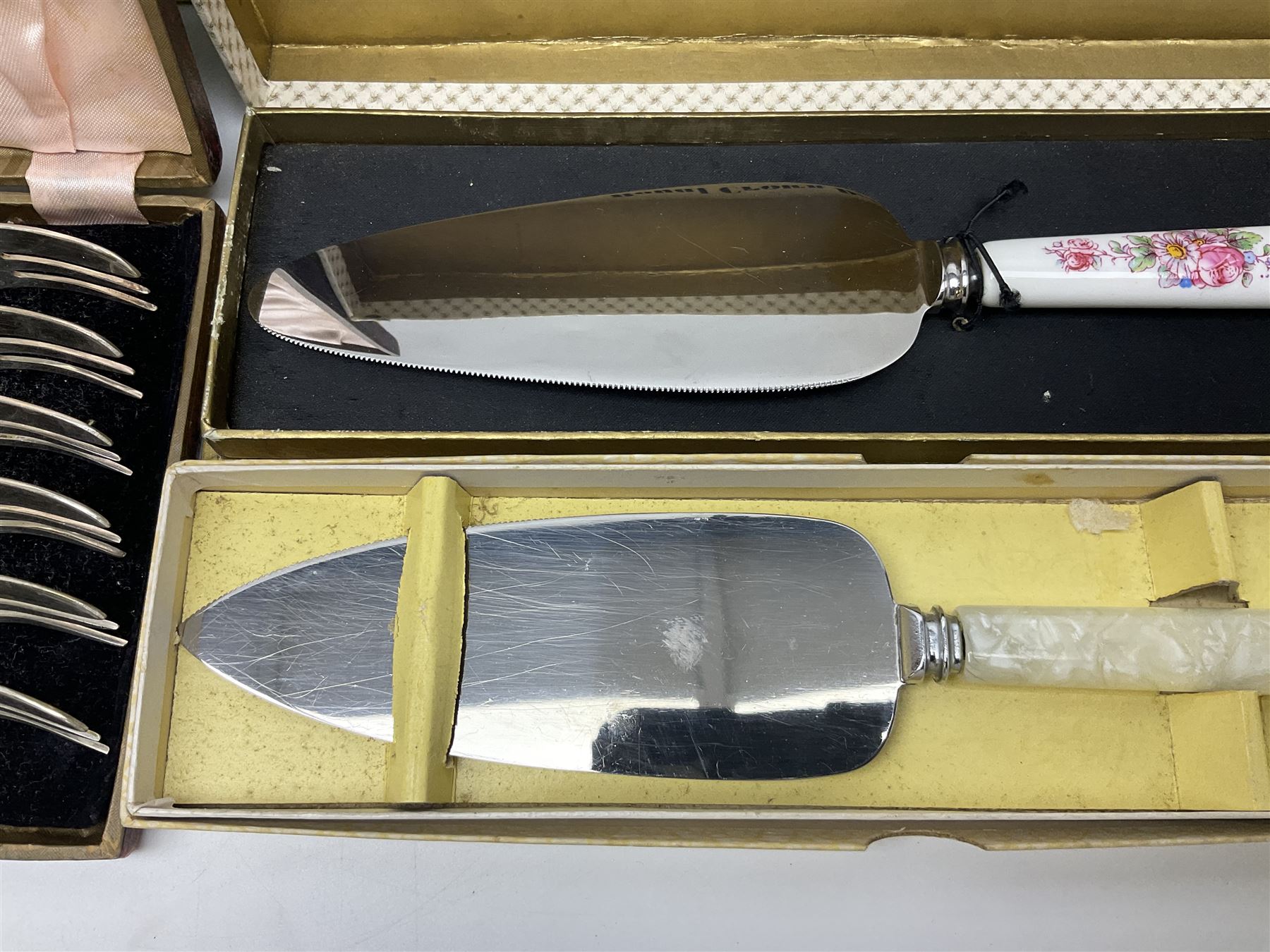 Collection of silver-plated cutlery including cased set of six EPNS cake forks, Royal Crown Derby pie server, sugar tongs, ladles, etc