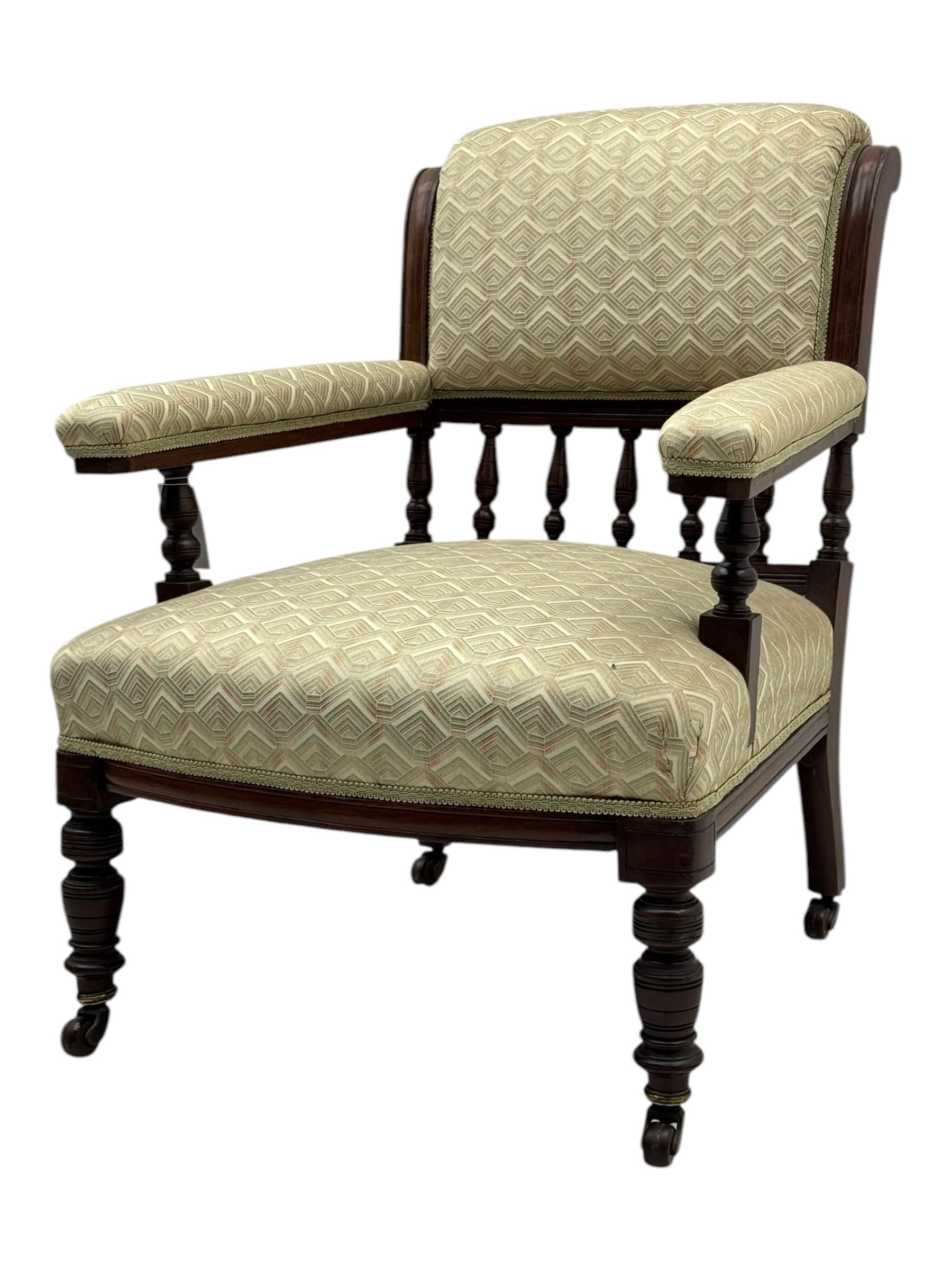 Late Victorian mahogany framed armchair, scroll back with spindle gallery, upholstered seat back and arms