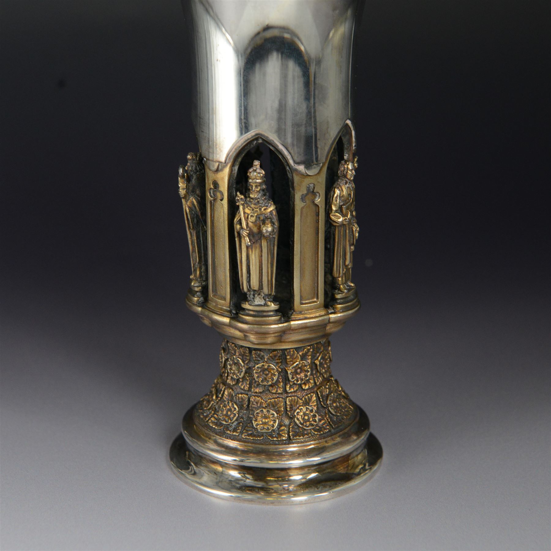 Modern limited edition silver goblet, 'made by order of the Lord Bishop of Ripon to commemorate the foundation of the Diocese in 1836', designed by Hector Miller for Aurum, the plain fluted cup, upon an ornate figural parcel gilt stem and stepped circular foot, no. 112/500, hallmarked Hector Miller, London 1985, H17cm, with certificate