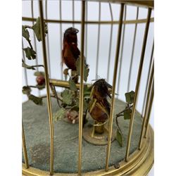 A mid 20th century automaton of two birds within a cage, the base of the cage decorated with panels of putti, (a/f), not including suspension ring handle H23cm.