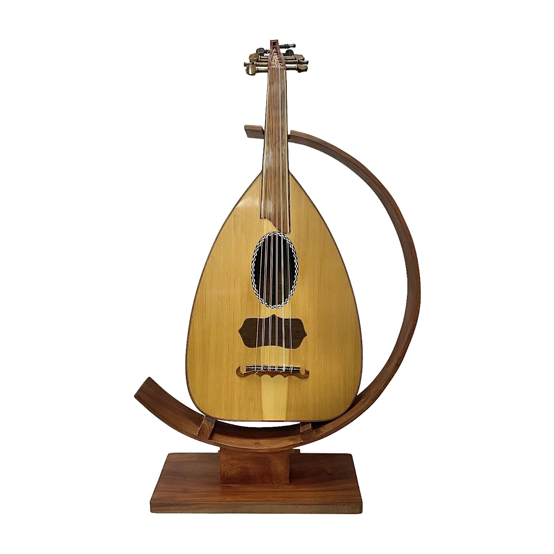 20th century Middle Eastern six string lute with a segmented back and a purpose designed hardwood stand