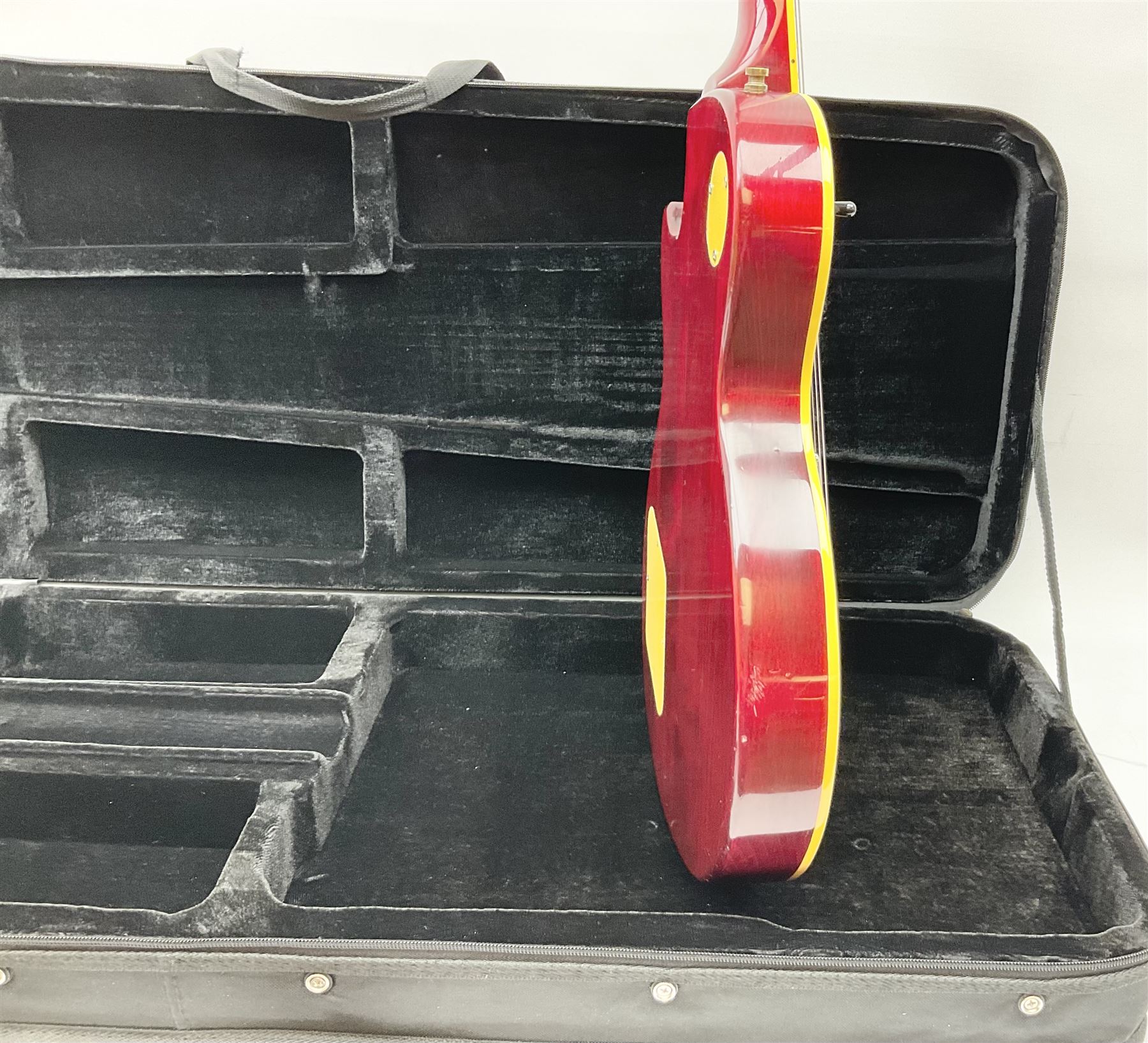 1980s Les Paul Epiphone limited edition cut-away electric guitar by Gibson, the burgundy coloured body with two pick-ups, volume and tone knobs and scratch plate, original tuning pegs, serial no.U6030215, 101cm overall; in modern Kinsman fitted carrying case