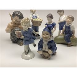 Five Royal Copenhagen figures, comprising Pan playing pipes no 1736, Boy on marrow no 4539, Baby crawling no 1518, Drummer boy no 3647 and Boy with apples no 4532, together with three similar figures