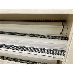 Six shelved cabinets for displaying ‘00’ gauge locomotives comprising plain plywood and white painted examples with track applied to various shelves, largest H63cm, W107cm, D27cm; Collection of tools for building model locomotives to include Weller PU-2D Soldering Pencil and Standard Tip Soldering Iron 20W/230V, Humbrol Modellers Airbrush, Power Supply Units and two wooden chests one of which housing a collection of tools including tweezers, scalping tools, wrenches etc 