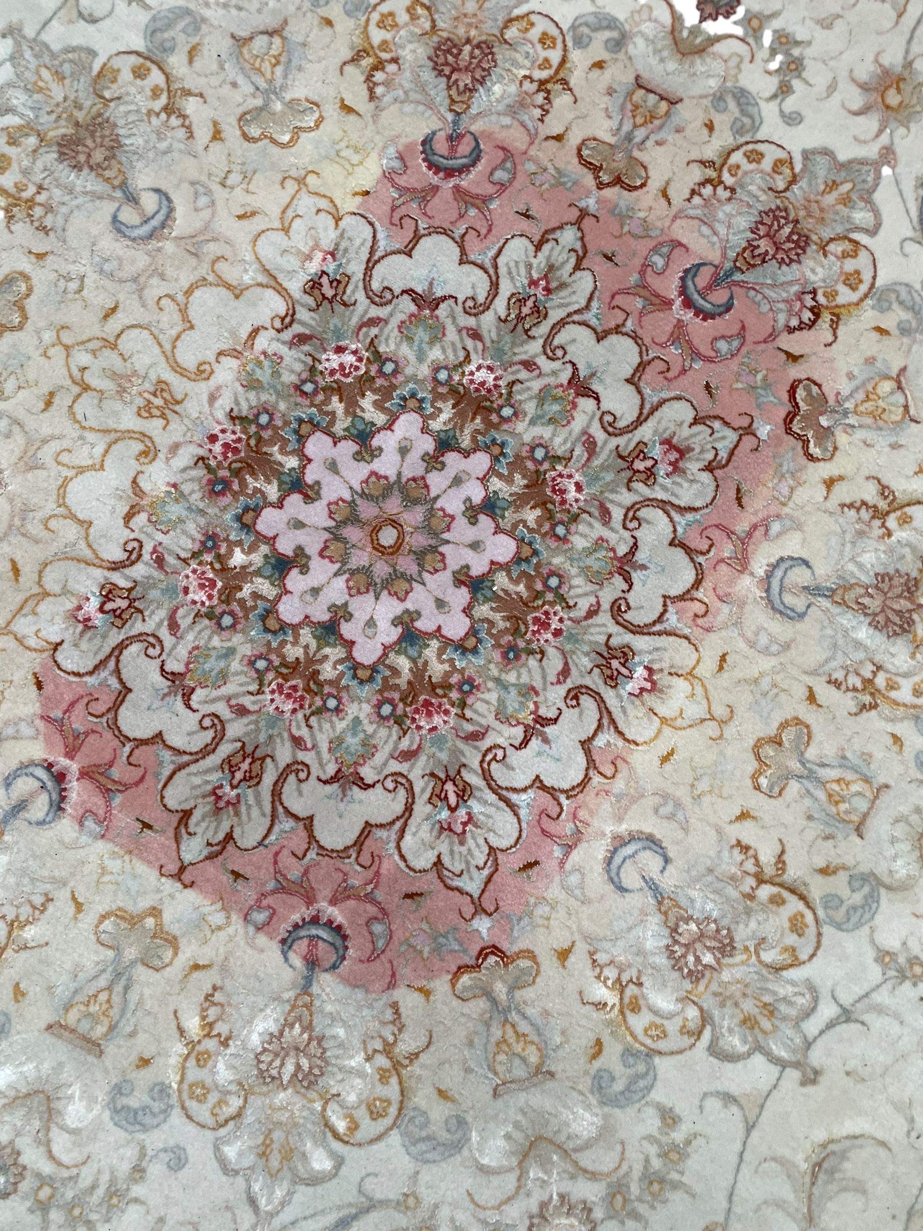 Persian Mahal densely knotted ivory ground carpet, floral rosette medallion surrounded by interlacing leafy branches and palmettes, scrolling border decorated with foliate motifs, within guard stripes, with signature panels to each end