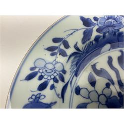 Japanese Meiji period Arita blue and white plate, of circular form, painted with riverside landscape and bird upon flowering branch, with character mark beneath, D24.5cm, together with two 18th century Chinese blue and white plates, each painted with floral design, each approximately D22.5cm