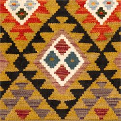 Afghan Maimana flatweave kilim runner, central field features large bold nested diamond motifs and stylized geometric lozenge patterns on olive purple, blue, and green tone ground, border stripe in orange ground, and fringe