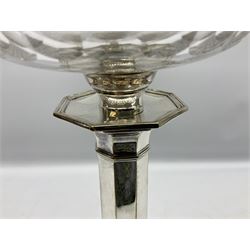 20th century Hawksworth, Eyre & Co silver plated oil lamp, the octagonal stepped base with engraved dedication, leading to an octagonal column supporting a faceted clear glass reservoir, Hinks Duplex burner, clear glass chimney, and cranberry glass shade, overall H71.5cm