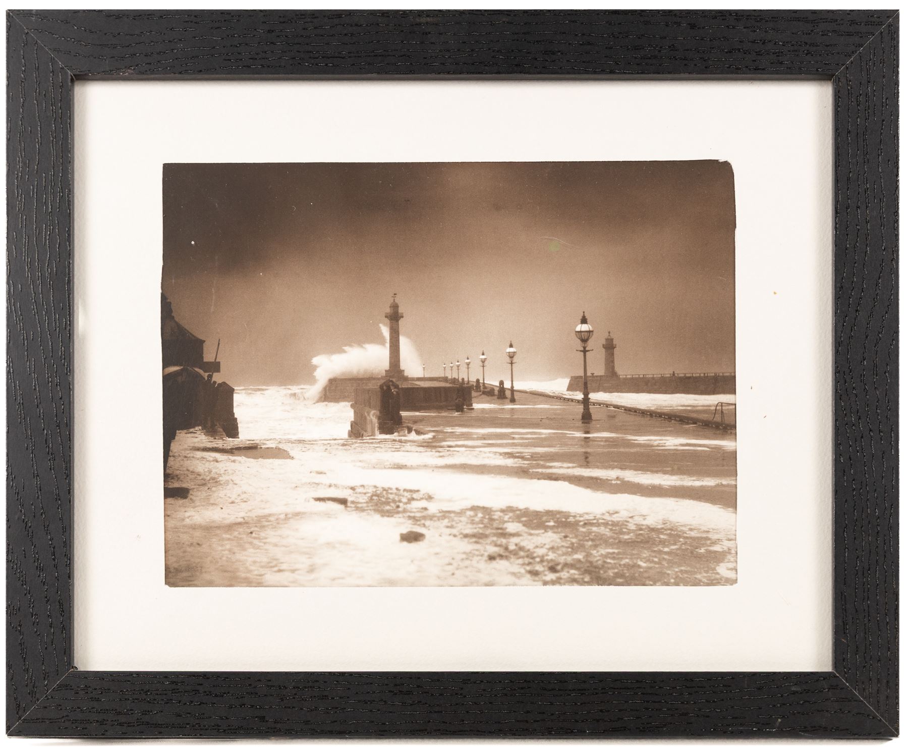 After Frank Meadow Sutcliffe (British 1853-1941): High Seas on Whitby's West Pier, photographic print unsigned 19.5cm x 26cm