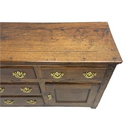 George III country oak dresser base,  rectangular top over with three central drawers flanked by two drawers and two panelled cupboards, each with moulded fronts, on stile feet