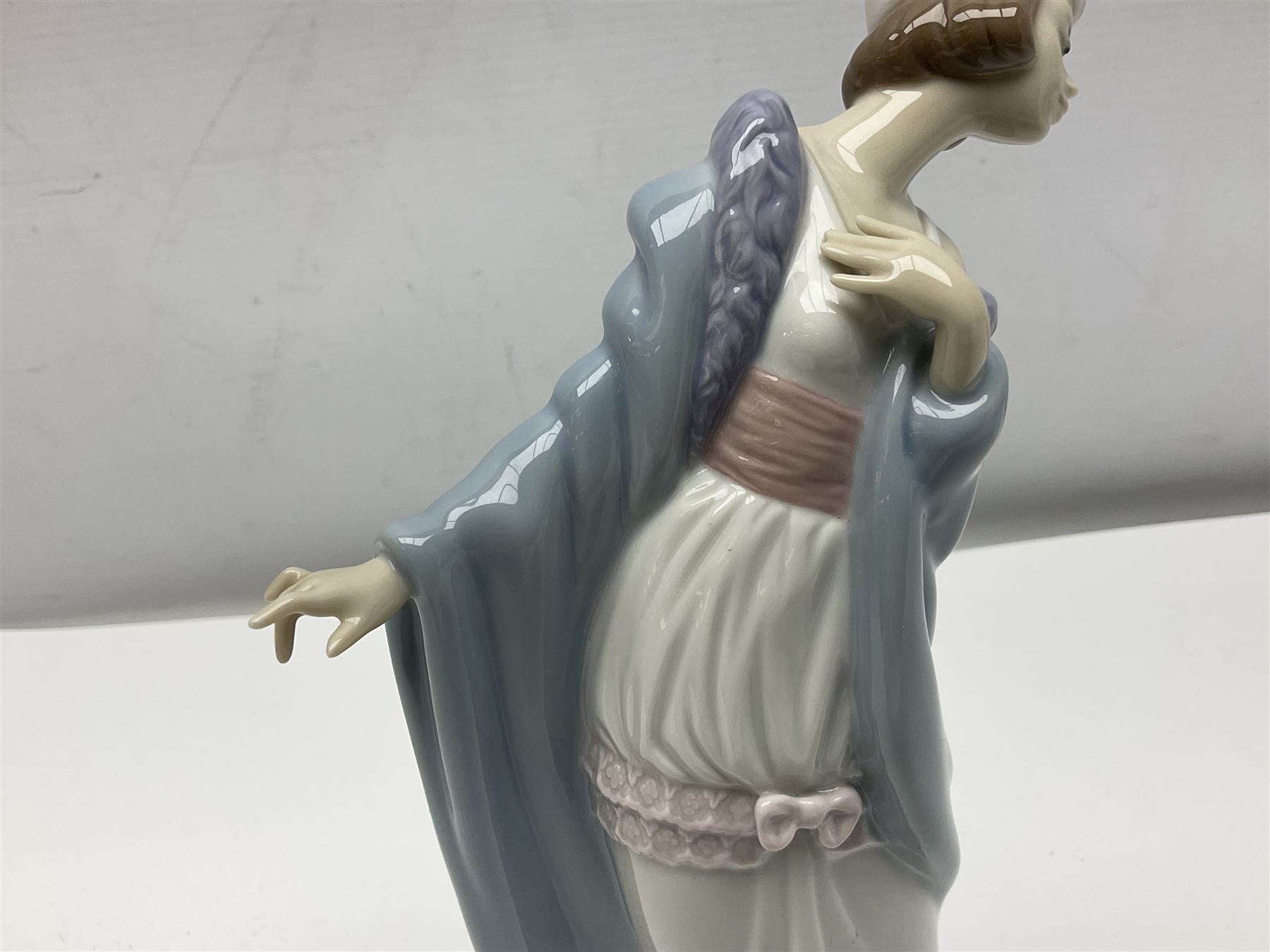 Three Lladro figures of ladies comprising 'The Flirt' model no 5789, 'Ingenue' model no 5487 and 'Carefree' model no 5790, all with boxes