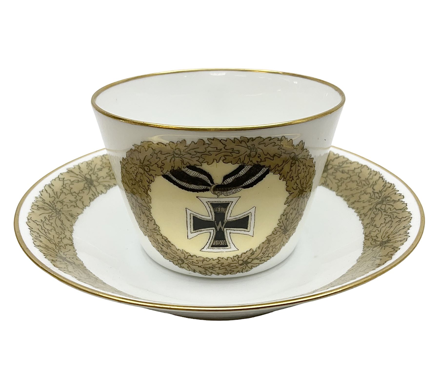WW2 Nymphenburg cups and saucer, decorated with Imperial German Iron Cross encircled in a foliate boarder with gilt edging, with printed mark beneath 