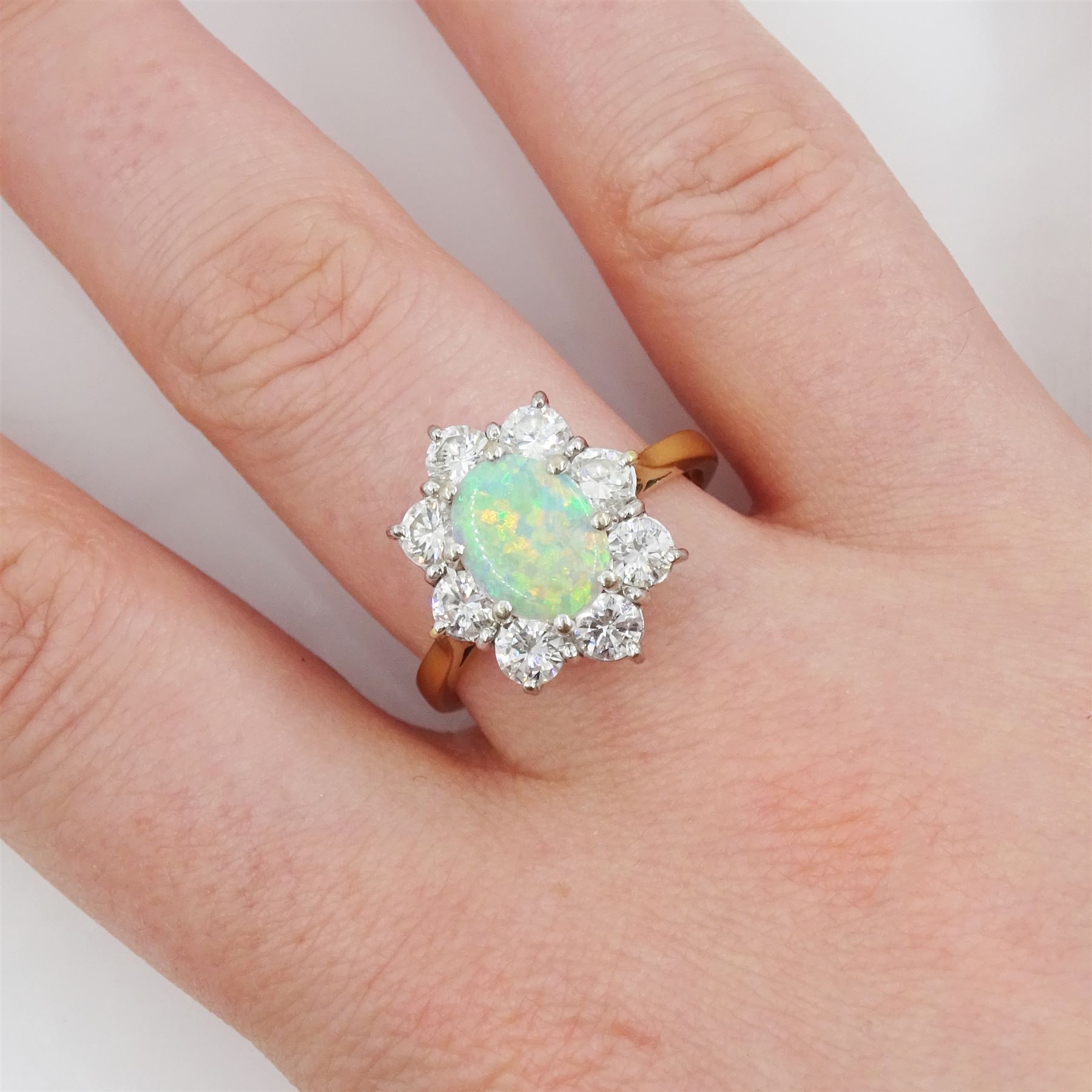 18ct gold opal and round brilliant cut diamond cluster ring, London 1976, opal approx 0.75 carat, total diamond weight approx 1.00 carat