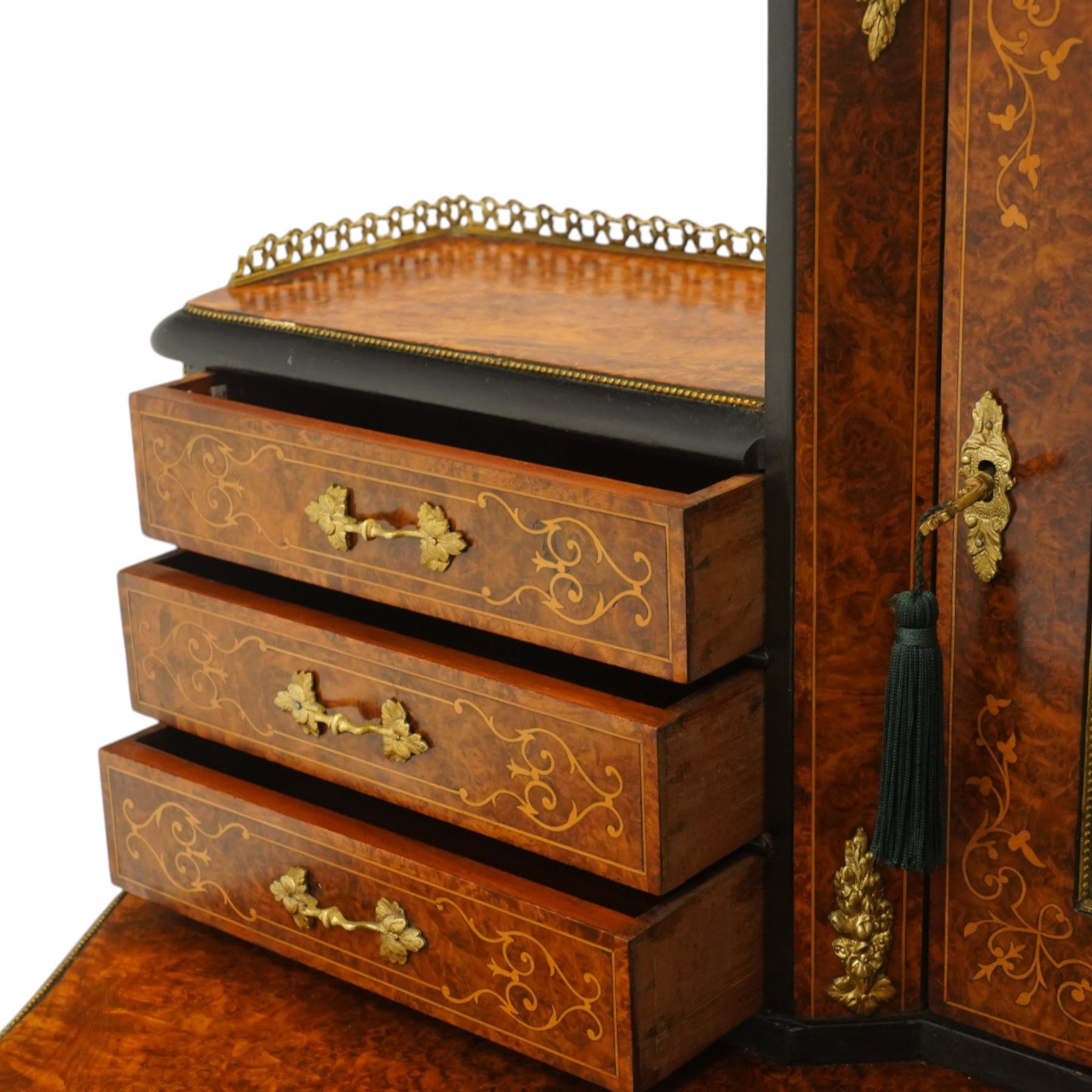 19th century French inlaid figured walnut and ebonised Bonheur de Jour or writing desk, the raised upper section with pierced brass three-quarter gallery, over a mirror glazed cupboard and a combination of drawers, the shaped and moulded top with leather inset and satinwood stringing, with brass beading too the ebonised edge, fitted with a serpentine fronted frieze drawer, raised on cabriole supports, inlaid throughout with scrolling foliate decoration in boxwood and ornate cast brass mounts and handles