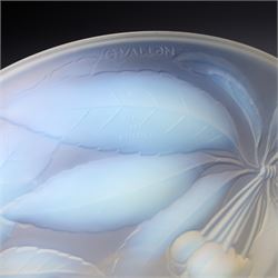 G Vallon, a French opalescent glass bowl decorated with a raised pattern of cherries and leaves signed G Vallon D23cm