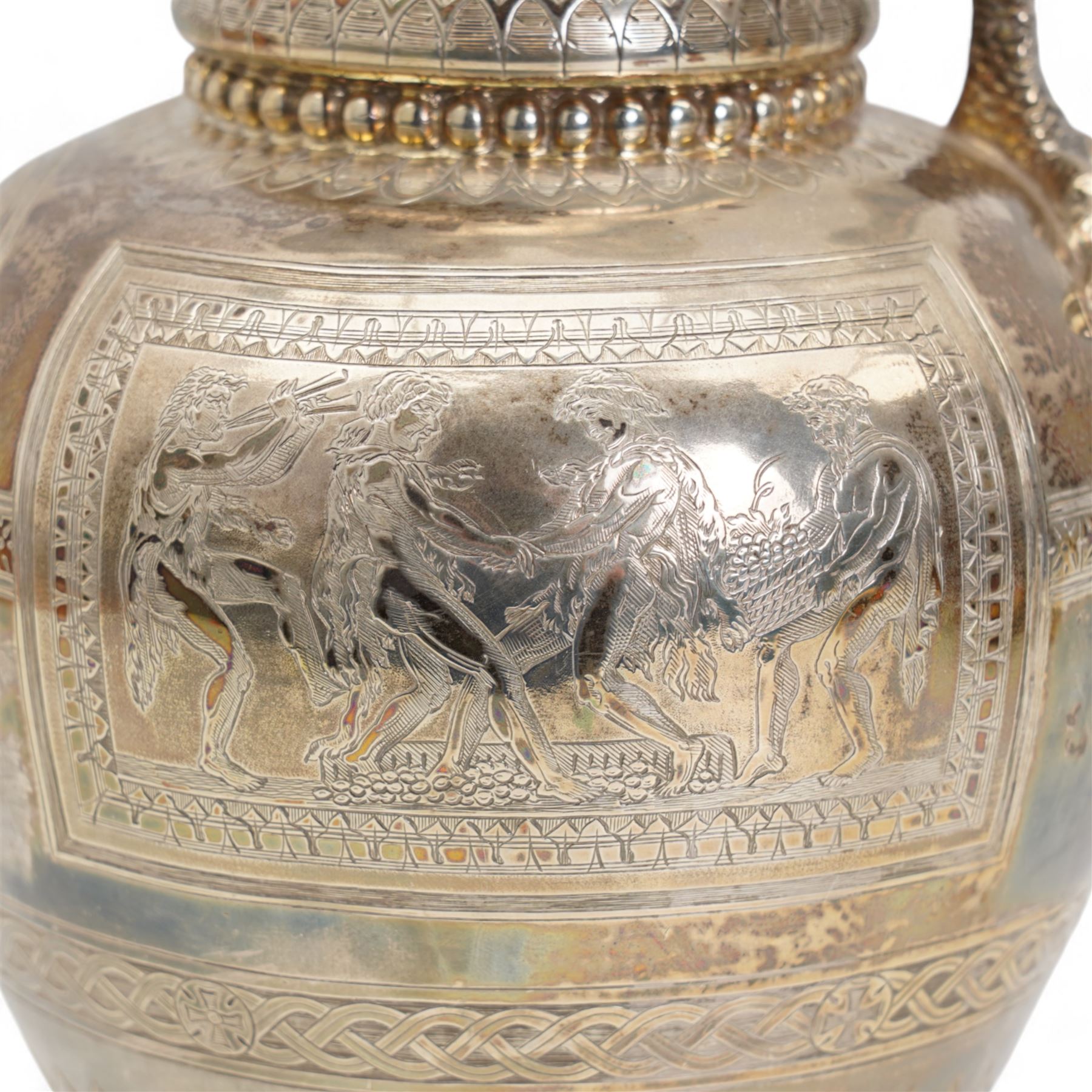 Victorian silver claret jug of baluster form engraved with Greek dithyramb panels in honour of  Dionysus, the spout with the mask of Pan, the scroll handle with birds foot terminal and with further engraved guilloche and other decoration H36cm Sheffield 1864 Maker Roberts & Belk. This item has been registered for sale under Section 10 of the APHA Ivory Act
