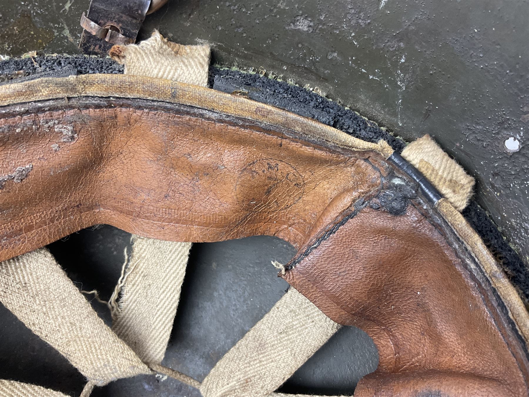 WW2 French M-26 Adrian Pattern Steel Helmet, original olive drab paint finish; flaming grenade badge to the front signifying issue to an Infantry regiment; original leather liner and leather chinstrap; and WW2 Dutch steel helmet with liner and chin strap (2)