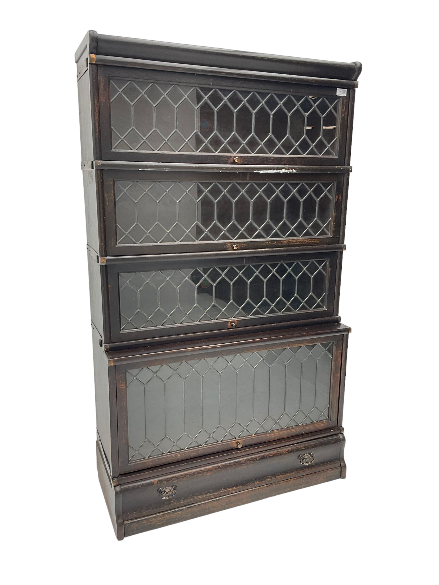 Globe Wernicke - early 20th century oak stacking library bookcase, enclosed by four lead glazed doors, fitted with single drawer