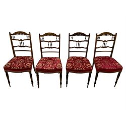 Edwardian inlaid rosewood salon suite, upholstered in red and gold fabric, comprising two seat sofa, pair of tub shaped armchairs, and four side chairs