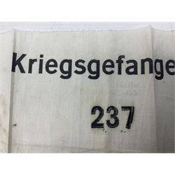 German POW armband printed in black 'Kriegsgefangener 237' on a white ground; and an 'SS' Reinhard Heydrich mint postage stamp (2)
