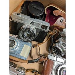 Collection of vintage cameras, including Zeiss Ikon, Canon Canonet, Ensign, etc