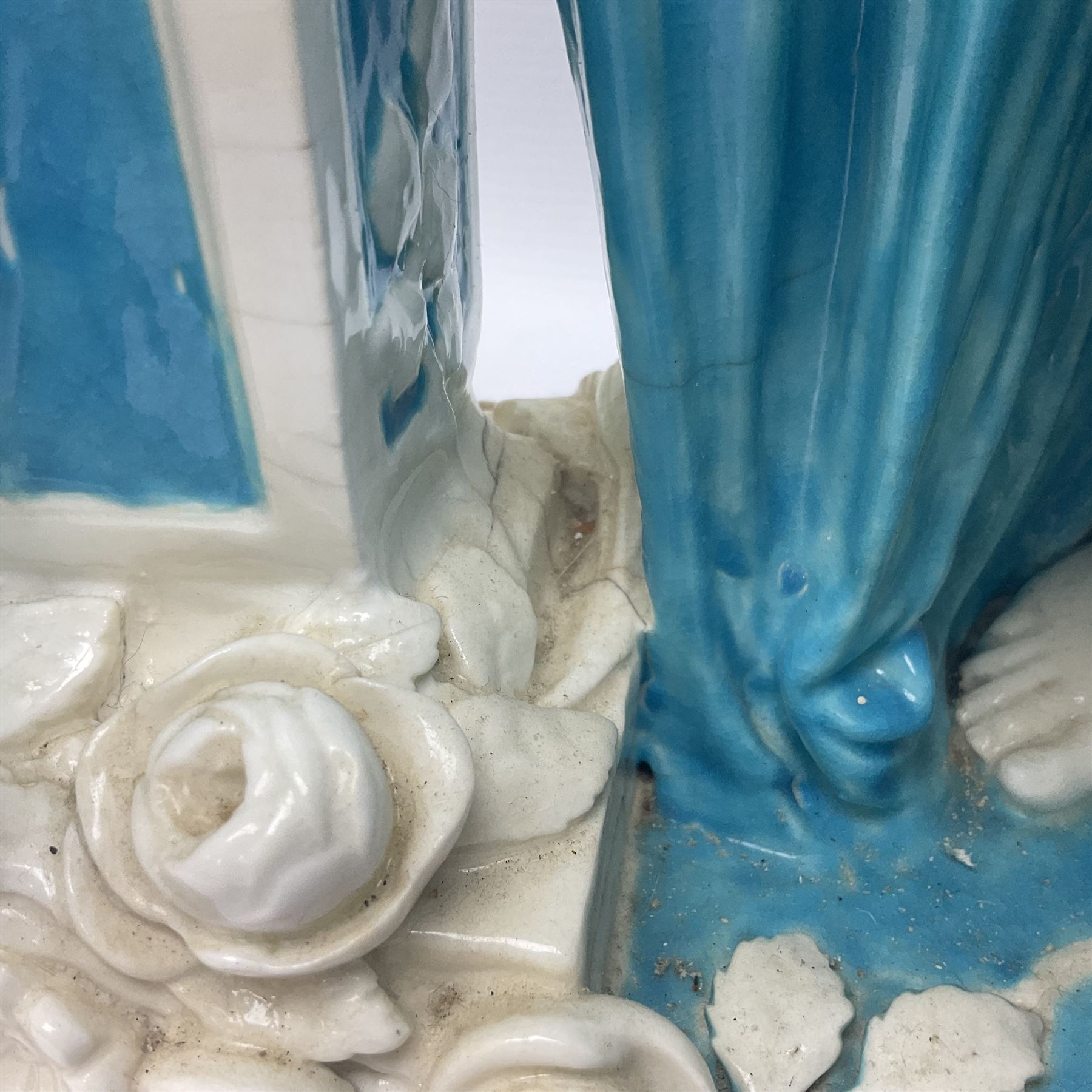 Rare 19th century Minton turquoise glaze majolica 'The Reader' flower holder, after Albert Carrier-Belleuse, modeled as a maiden in classical drapery reading whilst leaning against the pillar back of the helmet shaped cistern detailed with a caryatid and floral swags, the whole upon an oval plinth with Greek key border, with impressed marks beneath, H44cm