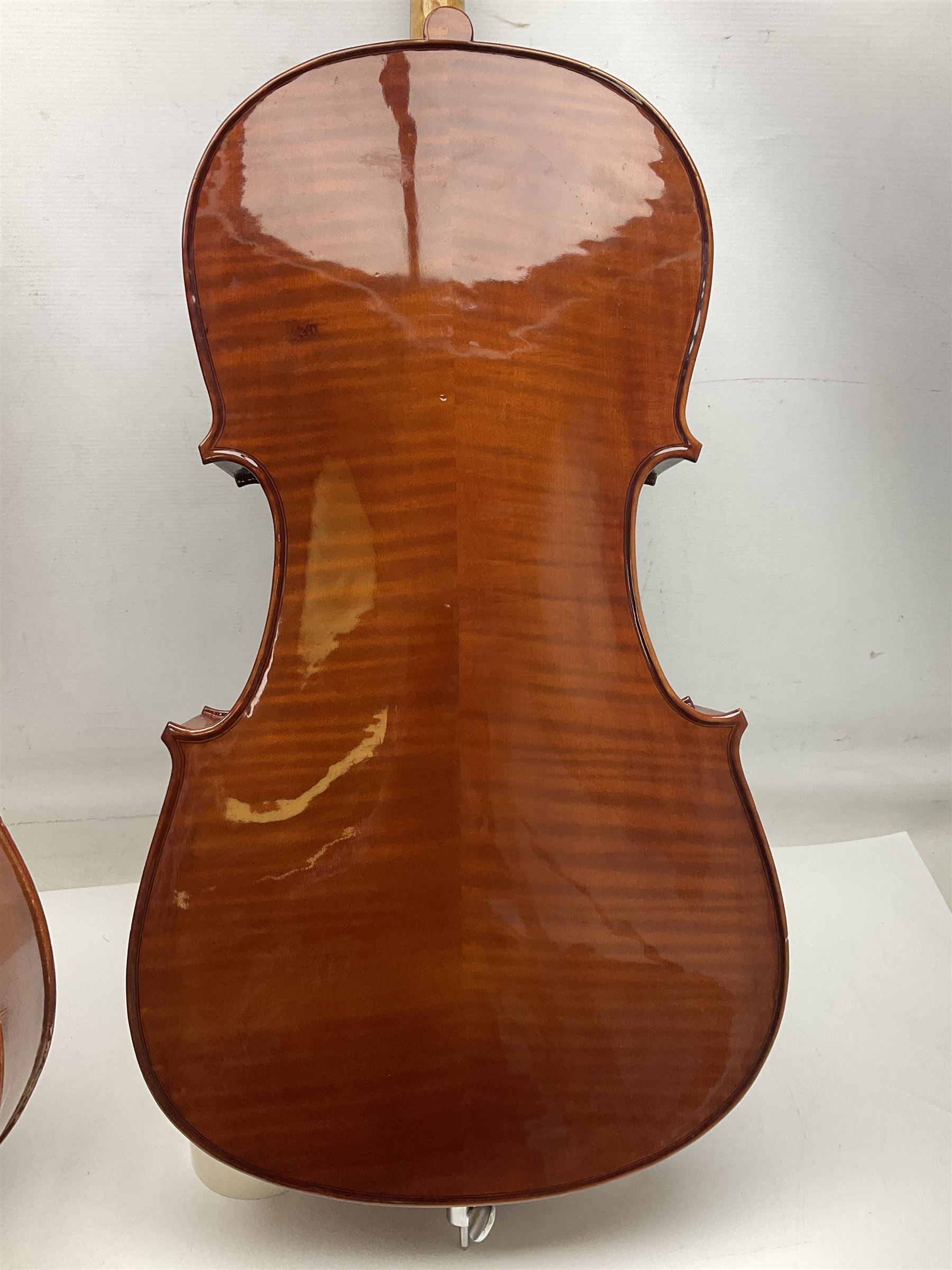 Modern Hungarian half-size cello with 69cm two-piece maple back and ribs and spruce top L114cm overall; and Stentor half size cello bearing label 'The Stentor Student II'; each in soft carrying case (2)