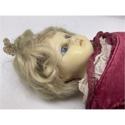 Victorian wax shoulder head doll with applied hair, inset blue glass eyes and kid leather body with jointed limbs; red dress and white linen underwear H42cm