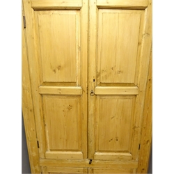  18th century country pine corner cupboard, shelved interior enclosed by four fielded panelled doors, W110cm, H194cm, D54cm  