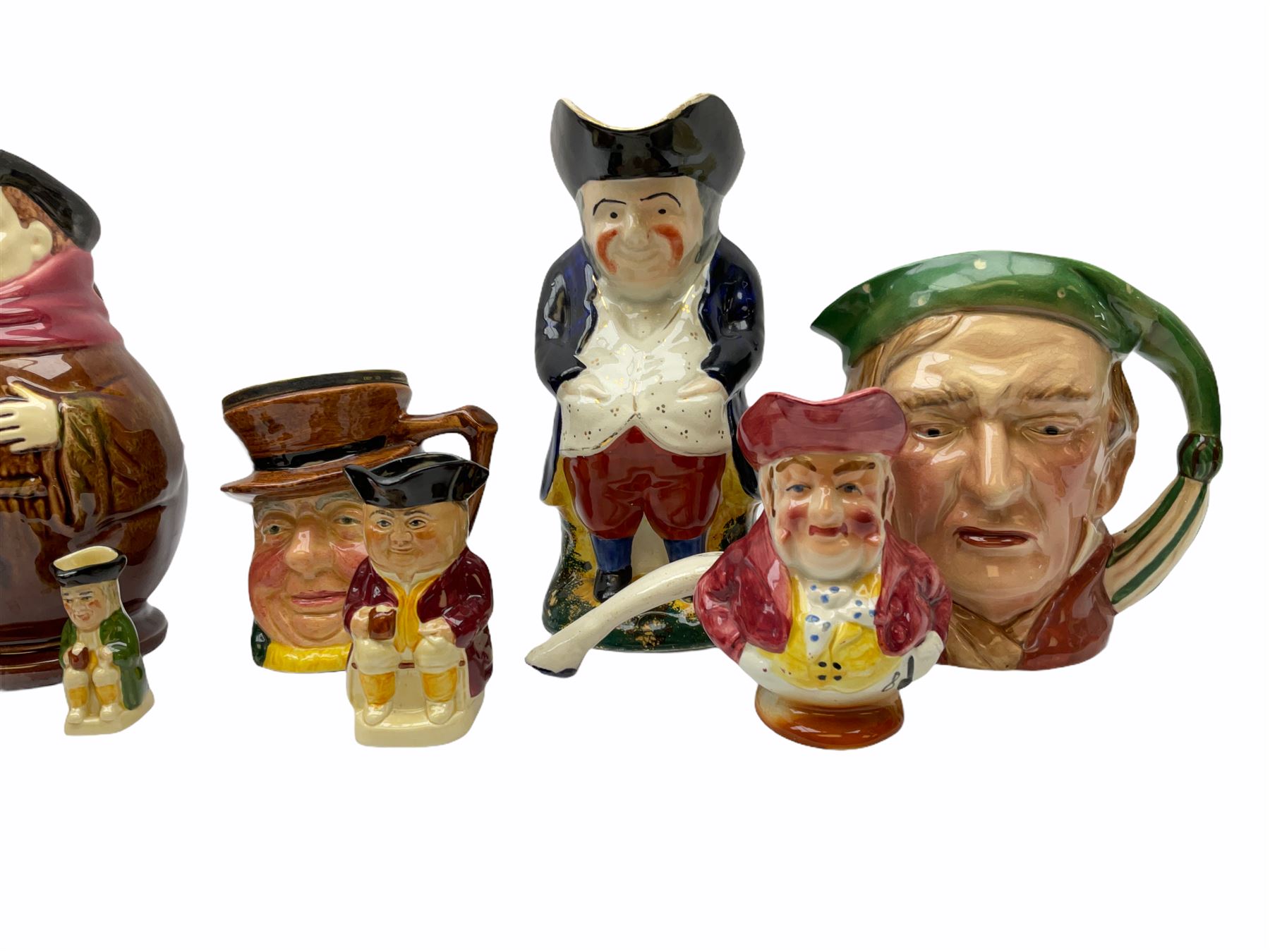 Character and toby jugs, including a staffordshire pottery style toby jug, Olfaire toby jug, Beswick character jug depicting Scrooge, Royal Doulton Veteral Motorist etc, together with Royal Doulton Sweet Dreams figure. 