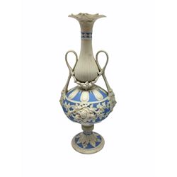 Victorian Parian ware twin handled vase detailed with Bacus masks fruiting vines and floral sprays H36cm, together with a Parian jug H14.5cm, classical Parian sculpture H40cm, decorative plaque decorated in high relief depicting two children D18.5cm. 