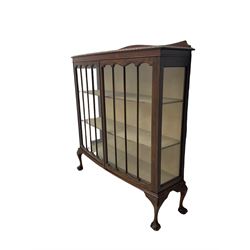 Early 20th century walnut display cabinet, enclosed by two glazed doors