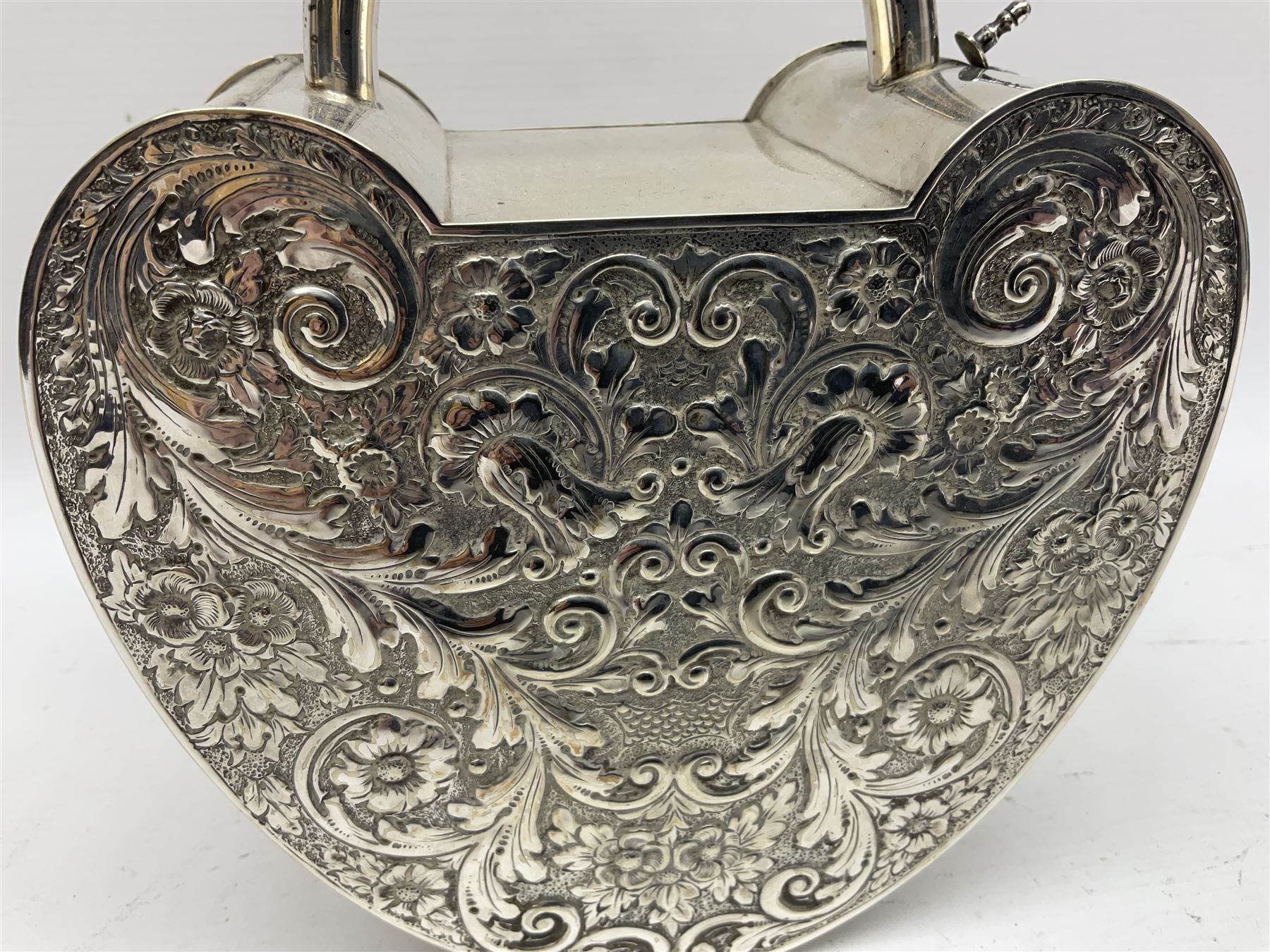 Silver plated, tea caddy, in the form of a heart, with repousse decoration, presented to H Whitcombe, H20cm