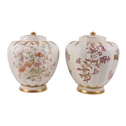Royal Worcester pair of blush ivory jar and covers, painted with floral sprigs and gilding...