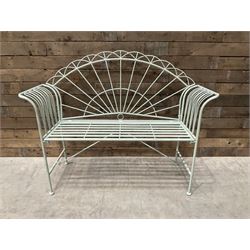 Wrought metal two seat garden bench, sunburst back, painted in pale green finish
