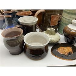 Wold studio pottery tankards, in various colours and relief decoration together with other studio items including vases, jugs and pots 