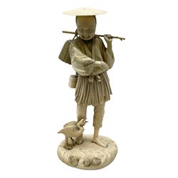 Japanese Tokyo School ivory figure on a circular base, 19th century, carved as a man carrying a basket with bird by his feet, with a three character signature beneath, H18cm