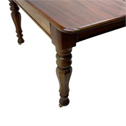 19th century mahogany extending dining table with three additional leaves, rectangular top with rounded corners, pull-out action, on turned and faceted supports with brass castors