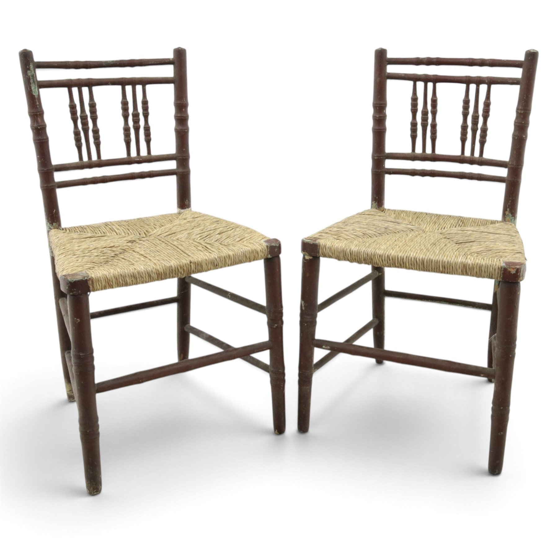 Pair of 19th century lacquered faux bamboo rush seated side chairs chairs, original blue paint under later ox-blood lacquer finish