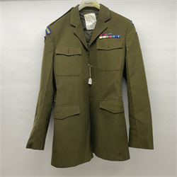 Two post-WWII British Army No.2 Dress tunics, one with Green Howards buttons; army shirt dated 1951; Royal Fleet Auxilliary jacket with trousers; three RAF/WAAF uniforms and RAF Greatcoat; and three canvas/webbing bags, two dated 1943 & 1945