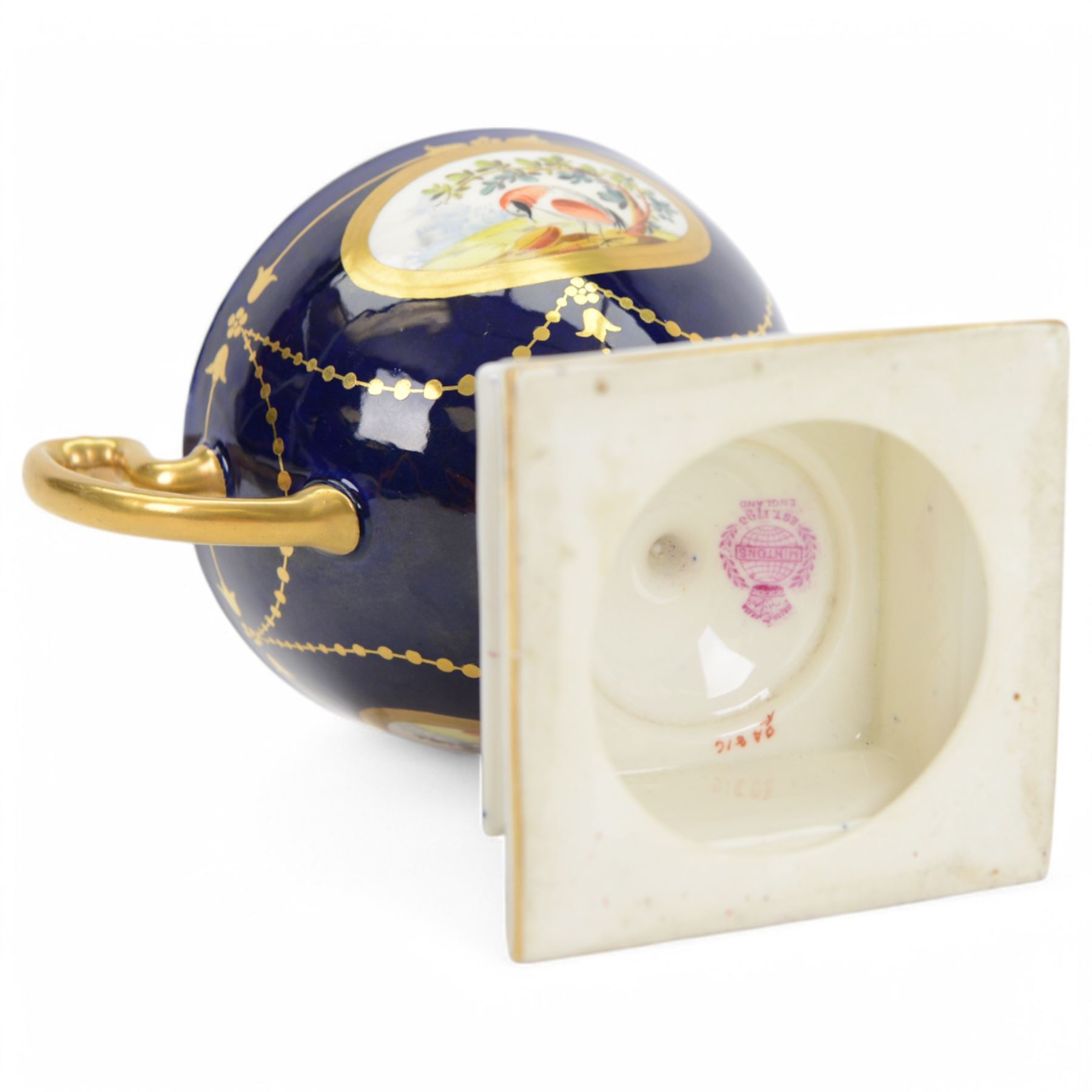 Early 20th century Minton porcelain twin handled pedestal cup, decorated with two reserve painted with birds against a blue ground, upon a square plinth painted with pink roses, the whole heighted with gilt, with puce printed mark beneath, H11.5cm, together with an early 20th century Minton twin handled vase, of ovoid form decorated with two painted portrait medallions, surrounded by gilt foliate scrolls, upon a blue ground, the neck painted with a band of pink roses, with gilt printed mark beneath, H11.5cm, and an early 20th century Minton twin handled pedestal vase and cover, painted with pink rose and vine swags upon a white ground, with puce printed mark beneath, H18.5cm, (3) 