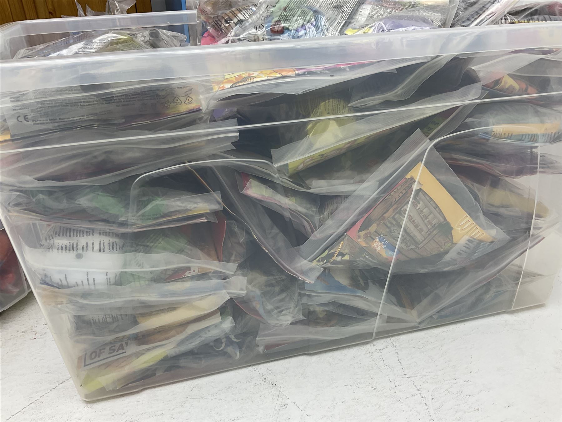 Large quantity of Mcdonalds toys to include Herbie and Polly Pocket in three boxes