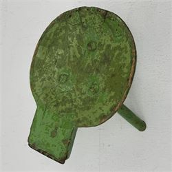 18th/19th century vernacular primitive green painted stool with dished seat fitted with metal scraper to one end, on three splayed legs, L46cm, H34cm