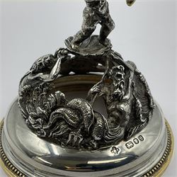 Modern limited edition silver mounted nautilus shell cup, no. 42/150, the pearlescent shell cup with silver-gilt strapwork to rim, upon a stem modelled as a putto supporting a gilt cornucopia and circular domed foot depicting Poseidon amongst swirling waves, hallmarked by St James House Company, London 1980,  H17.5cm